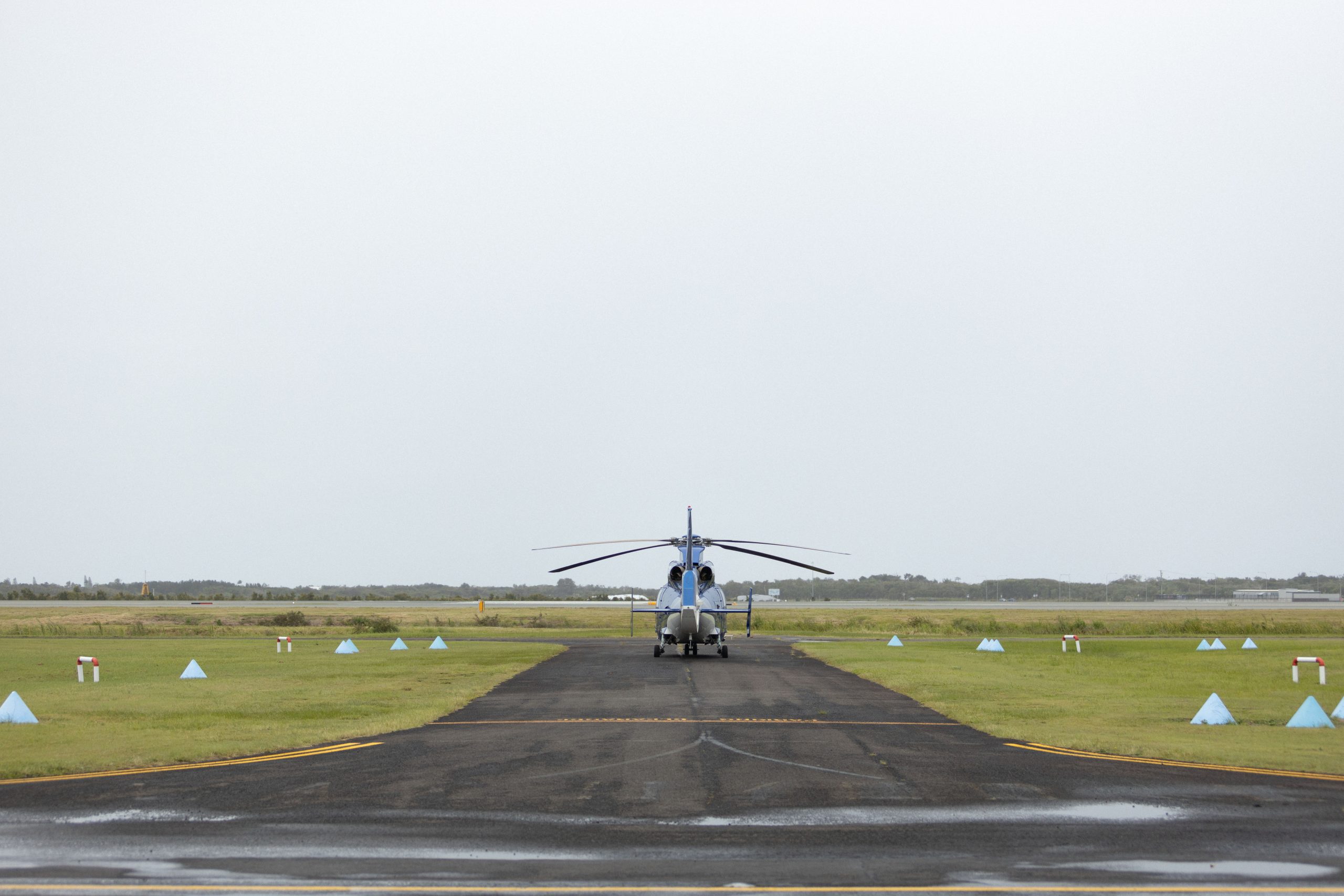 Helicopter on airport tarmac.