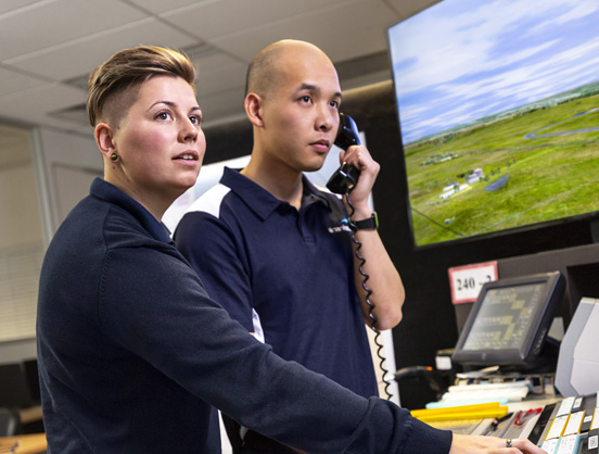 Two air traffic controllers working in our simulators.