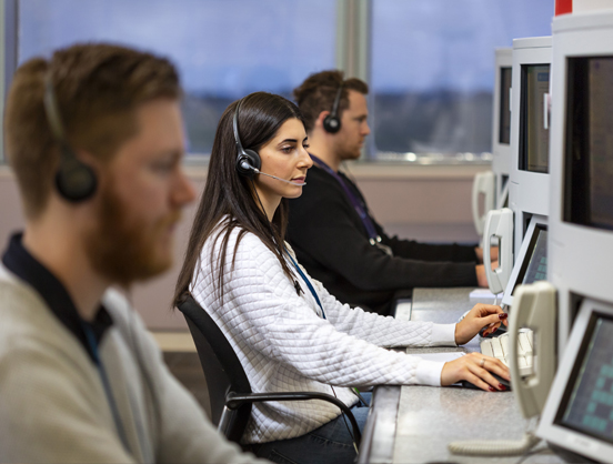 Enroute air traffic controllers in operations centre.