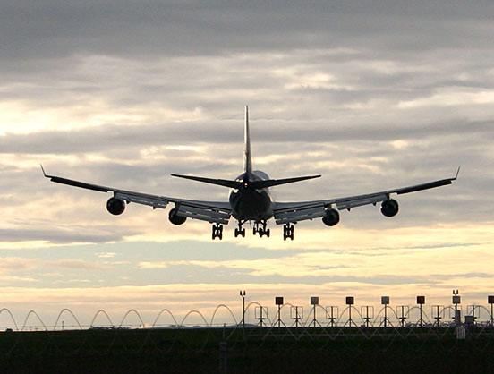 Aeroplane coming in to land at airport.