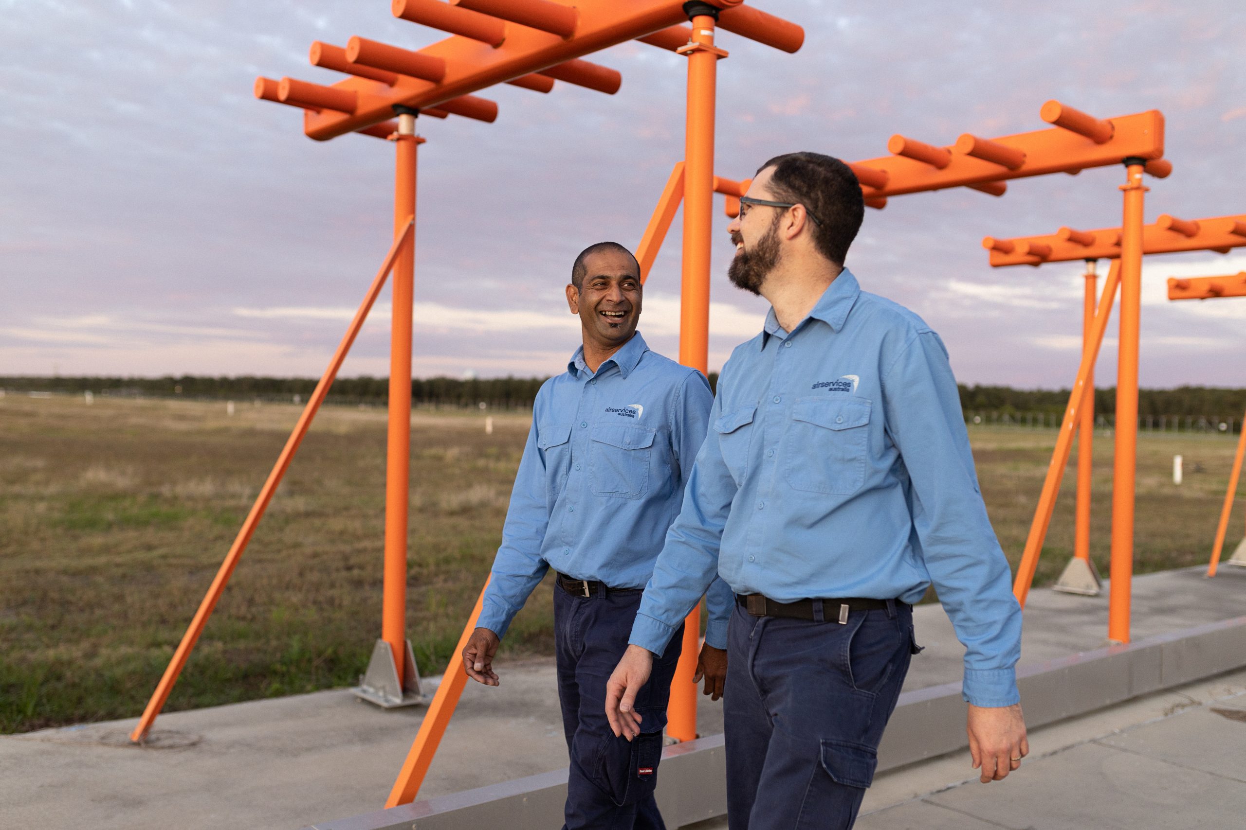 Airservices Australia technicians on site walking