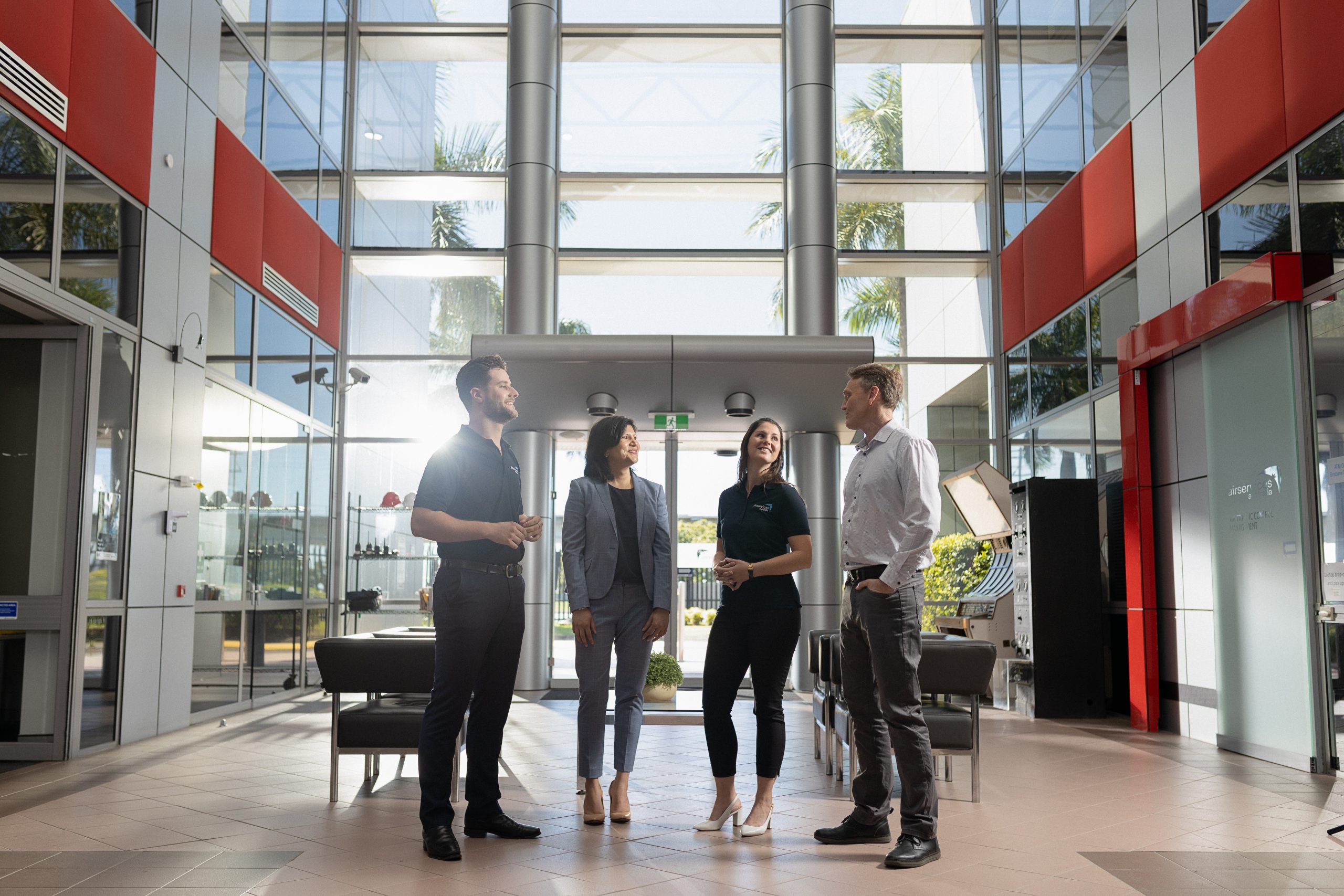 Airservices Australia employees chatting in an office lobby
