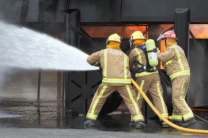 Fire fighters putting out a fire.