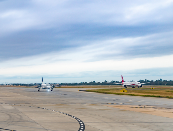 Airport construction - 552x418 Two planes on airport tarmac.
