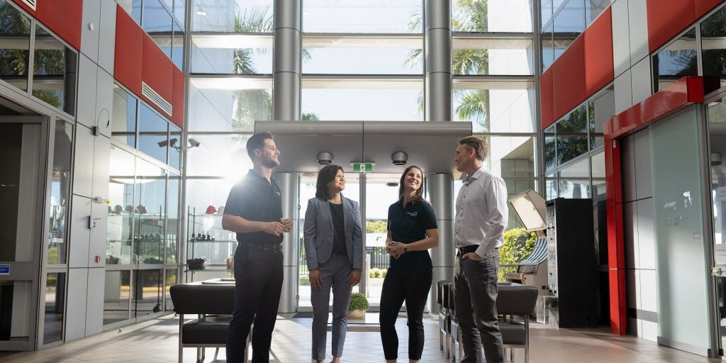 Airservices Australia employees chatting in an office lobby