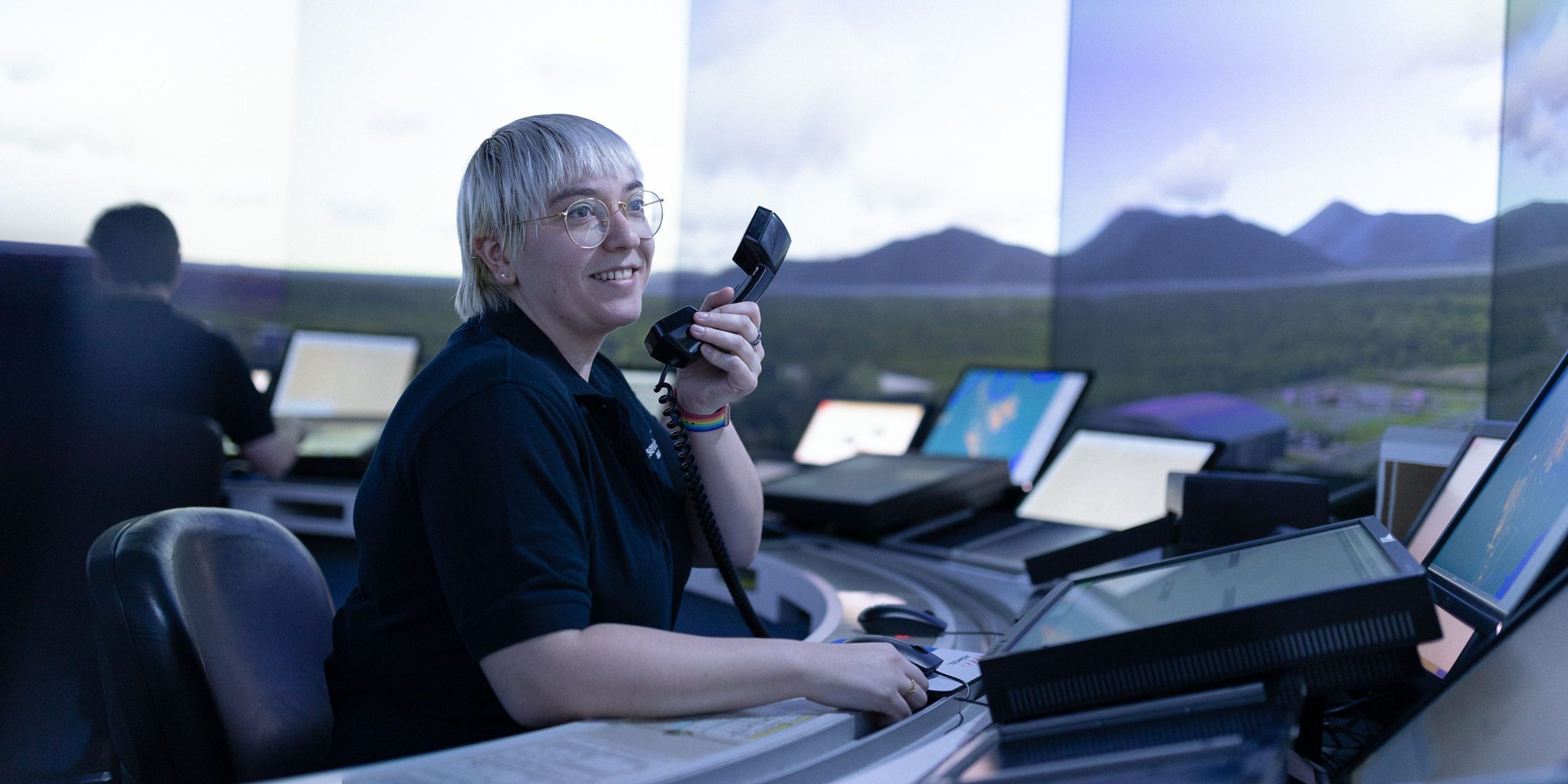 A woman air traffic controller sits in a Brisbane Air Traffic Tower SIM