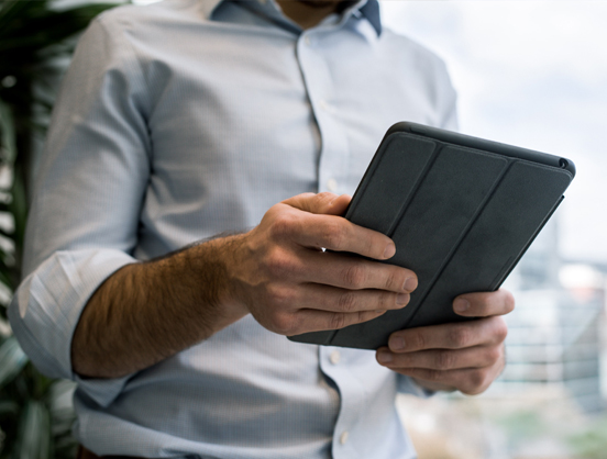 Person looking at a tablet.